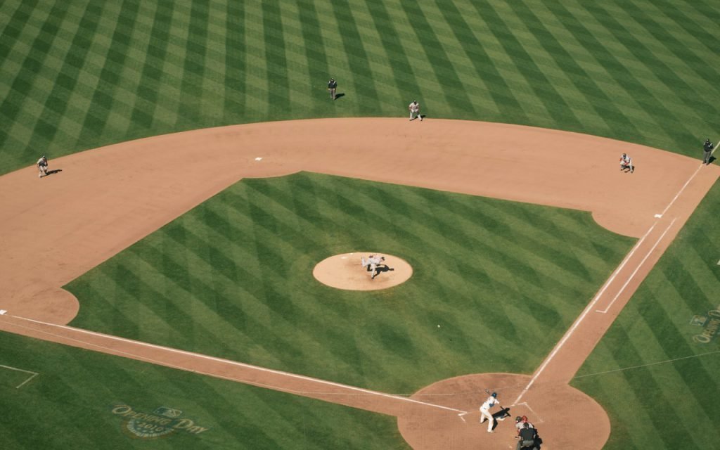 A packed baseball stadium under the lights