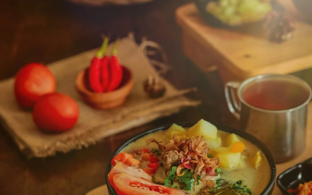 A dinner table spread with several shared dishes