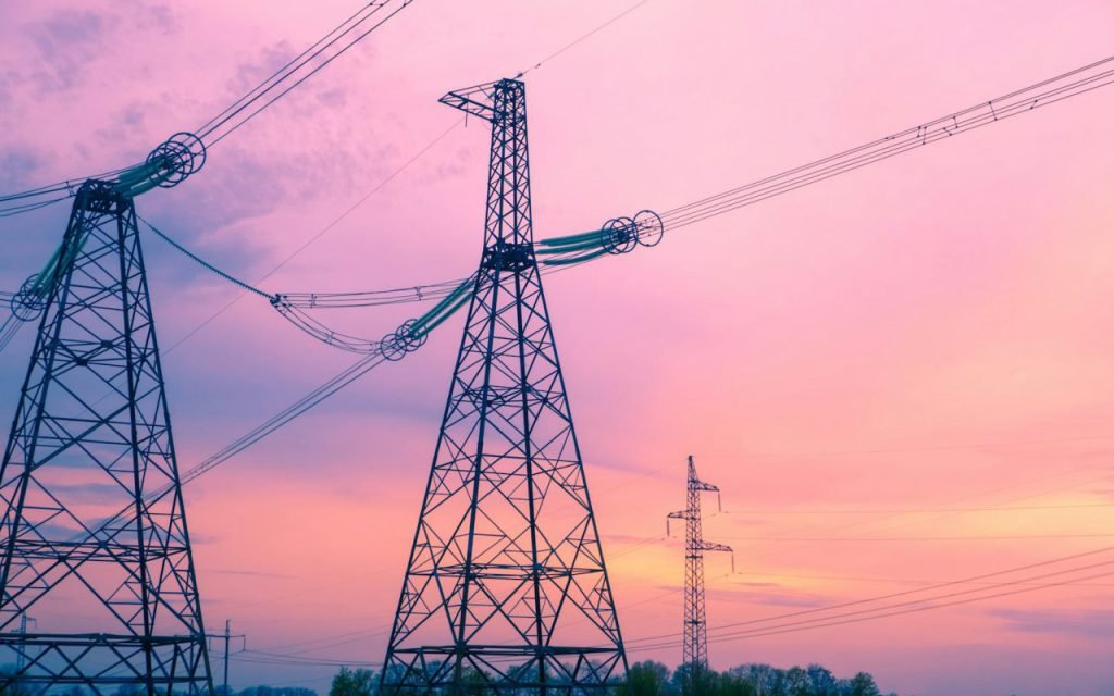 High-voltage power lines stretching across the sky