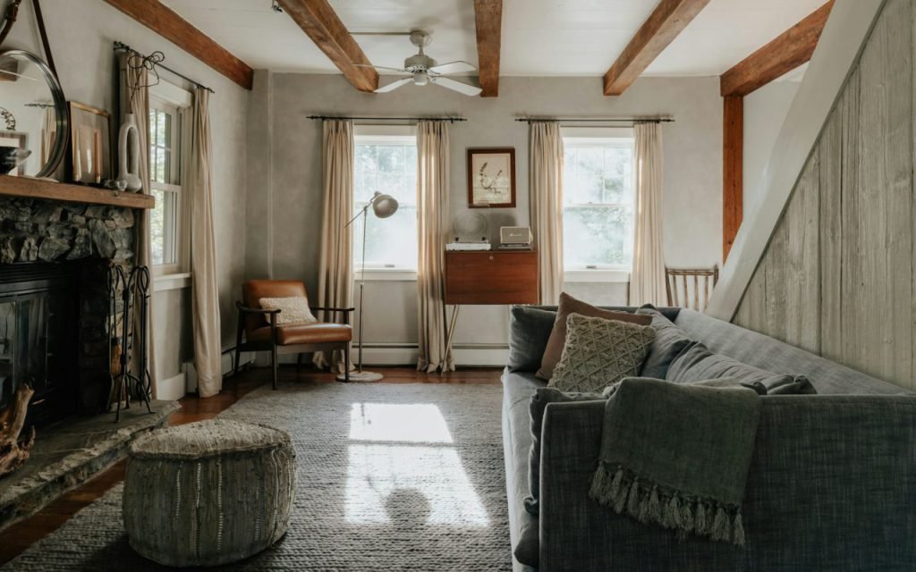 A warm, rustic living room in soft winter light