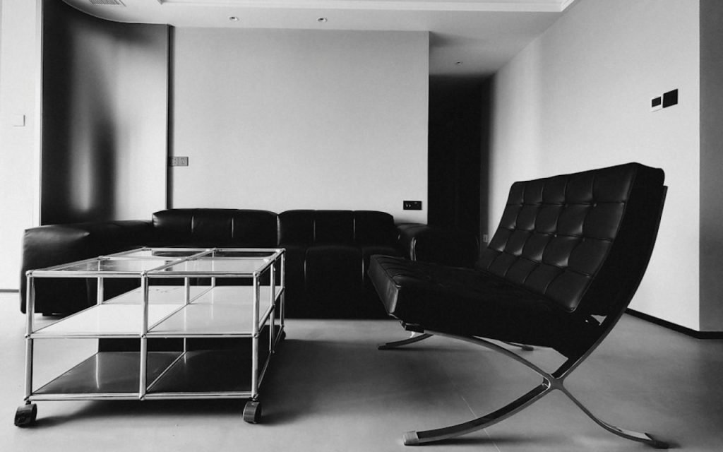An armchair with slim wooden legs in a bright living room