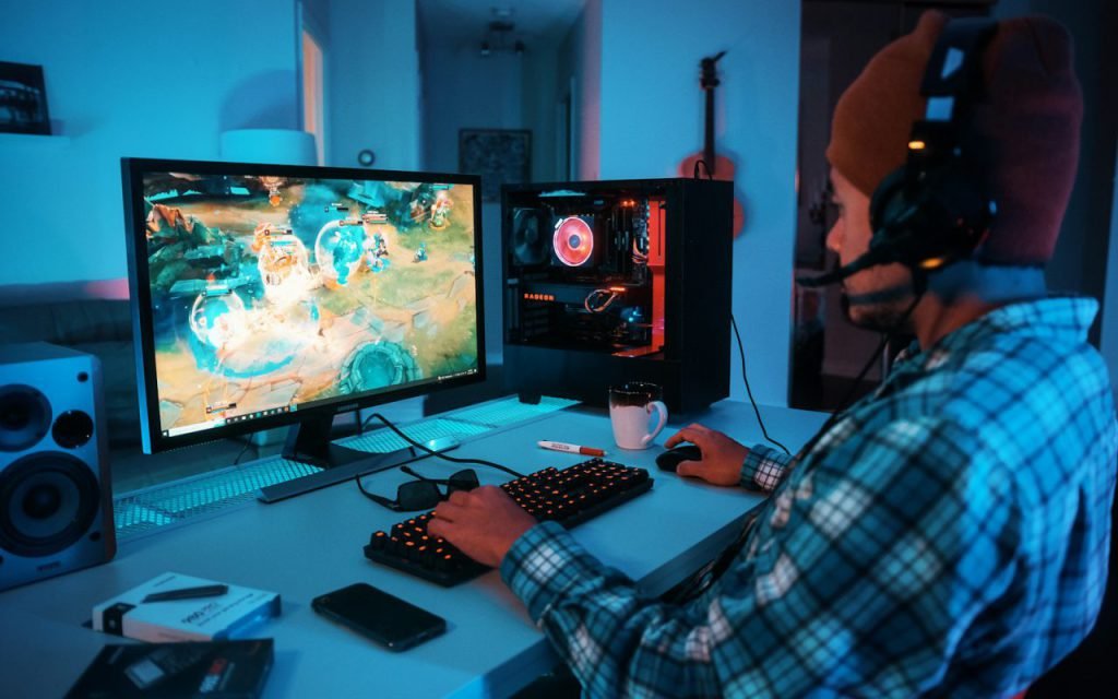 Developer working on code at a desk with two monitors