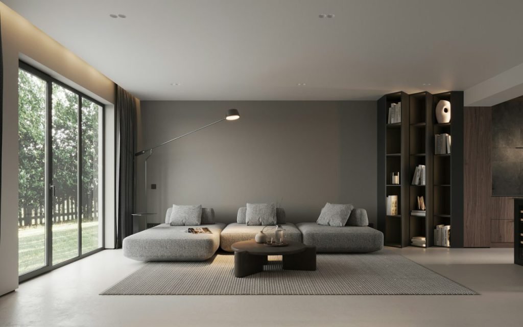 A living room with tall curtains framing a sunny window