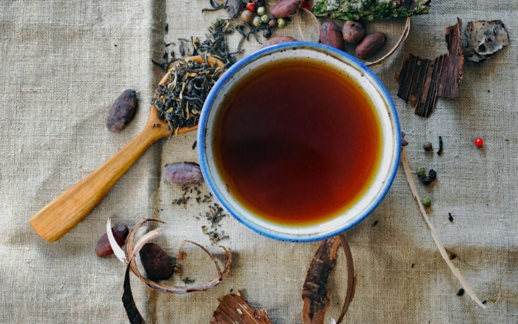 A cup of herbal tea on a wooden table