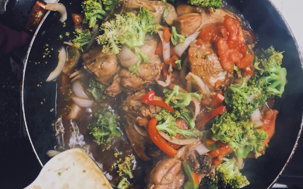 Stir-fried vegetables and beef in a pan
